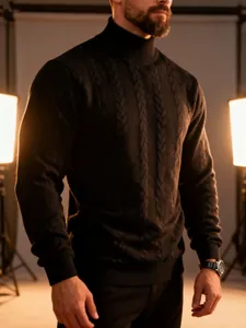 Detailed view of a men's black cable knit turtleneck sweater with rich texture