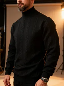 Detailed view of men's black cable knit turtleneck sweater showing thick warm texture