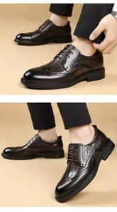 Macro detail of men's dark brown crocodile embossed leather brogue business shoes