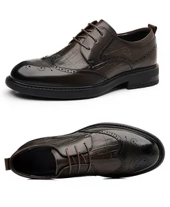 Detailed view of dark brown Brogue dress shoes with embossed crocodile pattern