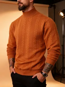 Detailed view of men's orange cable-knit turtleneck sweater showing thick texture.