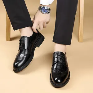 Men's black business dress shoes with crocodile texture and classic brogue detailing
