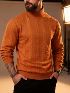 Close-up of orange men's cable-knit sweater showing high-neck and textured pattern