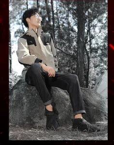 Man wearing waterproof non-slip outdoor snow boots in a forest camping setting