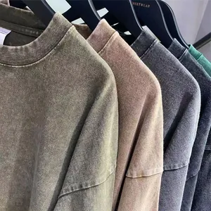 Macro detail of high-quality vintage acid-washed cotton t-shirts in various earth tones