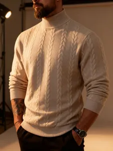 Close-up detail of beige cable knit turtleneck sweater showing thick texture and warm fabric.
