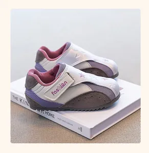 Side view of children's German trainer sneakers with purple suede and silver accents.