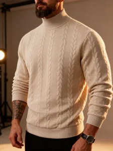 Close-up showing the detailed cable-knit pattern of this warm cream men's turtleneck sweater