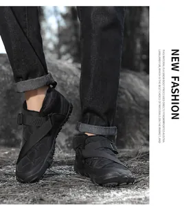 Close-up of waterproof black snow boots featuring quilted fabric and adjustable straps