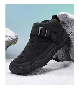 Detailed side view of black quilted outdoor snow boots with non-slip rubber sole