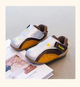 Close-up of premium girls' German trainer sneakers with star patterns and velcro straps