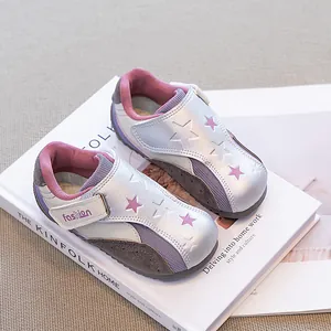 Stylish silver girls' casual trainer shoes with pink star patterns and velcro straps