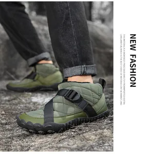 Detail view of olive green quilted outdoor snow boots on a forest floor