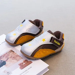 Casual toddler sneakers with star patterns and silver metallic finish