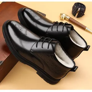 Detail of black leather brogue boots with warm fleece lining for business formal wear.