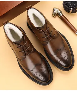 Detail of brown leather Brogue high-top boots with warm white fleece lining.