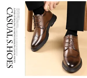 Close-up of brown brogue leather dress shoes for men with detailed wingtip carving