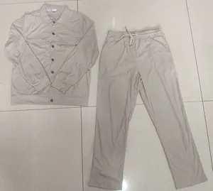 Men's two-piece corduroy cargo set featuring a long-sleeve jacket and drawstring pants.