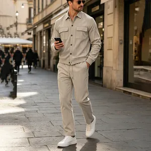 Close-up detail of men's beige corduroy set featuring multi-pocket jacket and pants.