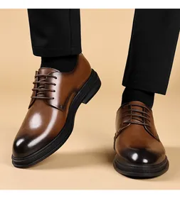 Detailed view of men's brown leather derby shoes with a stylish gradient and lace-up design