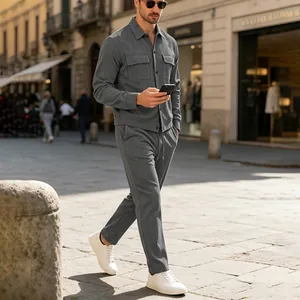 Stylish men's grey corduroy casual two-piece suit set walking on European street