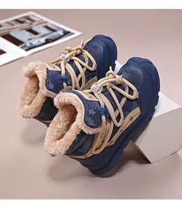 Detail view of children's navy camouflage snow boots with thick warm plush lining