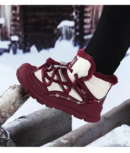 Detail view of child's warm winter snow boot with faux fur lining and sturdy laces.