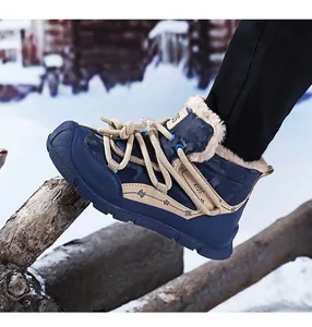 Close-up of children's fleece-lined snow boots with camouflage pattern and thick fur
