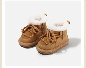 Detailed side view of brown children's snow boots with white faux fur lining and rope laces