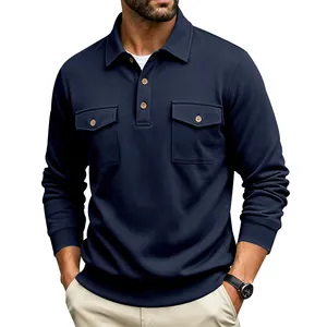 Detail view of a navy blue long-sleeved polo shirt with double chest pockets.