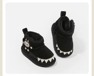 Cozy children's black snow boots with cute monster character and fleece lining