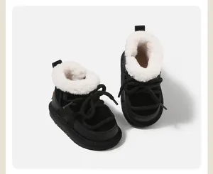Cozy black children's snow boots with white faux fur lining and trendy lace-up design