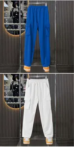 Detailed view of men's loose-fit heavy-duty cargo sweatpants in blue and white colors.
