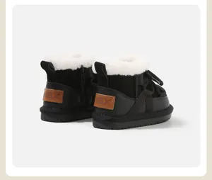 Detailed rear view of black children's fleece-lined snow boots with warm white lining