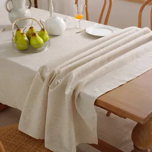 Detailed texture of natural linen cotton rectangle tablecloth draped on table