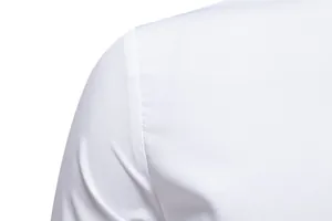 Detailed close-up of white dress shirt shoulder seam with professional stitching