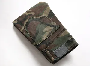 Detailed close-up of folded men's camouflage cargo jeans featuring back pocket and patch