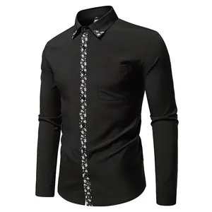 Detail view of men's stylish black long-sleeved shirt with floral paisley design trim.