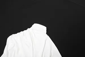 Close-up of elegant white turtleneck top featuring soft ruched fabric details for women