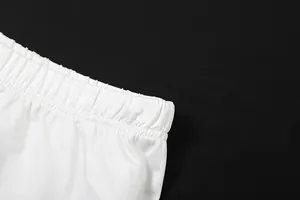 High-quality close-up showing the elastic waistband detail of a white pleated skirt