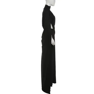 Side view of elegant black turtleneck pleated top and high slit maxi skirt set on mannequin