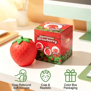 Vista detallada del juguete squishy de fresa realista grande con caja de venta