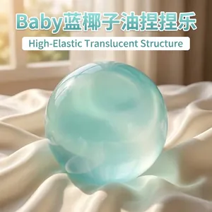 Close-up of a translucent baby blue squishy stress relief ball on soft white fabric background
