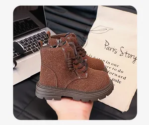 Detailed shot of brown suede children's boots with side zipper in British retro style