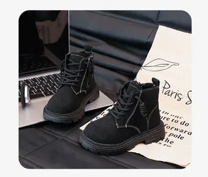 Detail of black British style children's Martin boots with side zipper design