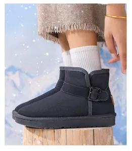 Detailed side view of child warm leather snow boots with buckle strap in winter scene