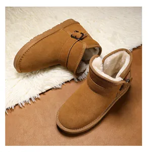 Detail view of kids' genuine leather snow boots with cozy fur lining and buckle strap