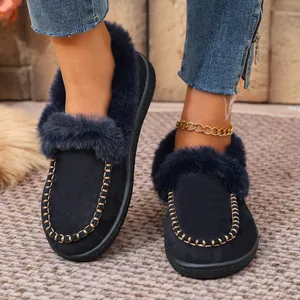 Cozy dark blue suede slippers with faux fur lining and decorative gold stitching
