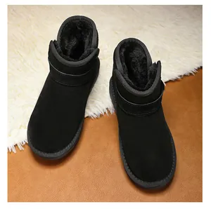 Top view of black kids snow boots showing soft warm faux fur lining and suede exterior
