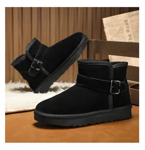 Side view of children's black leather snow boots with adjustable buckle strap detail
